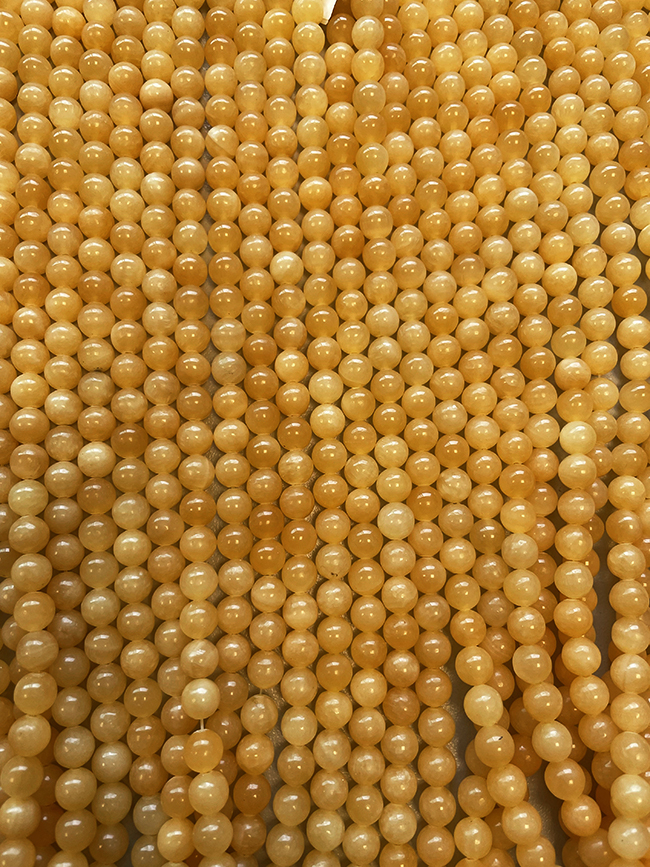 Orange Calcite A 6mm pearls on string